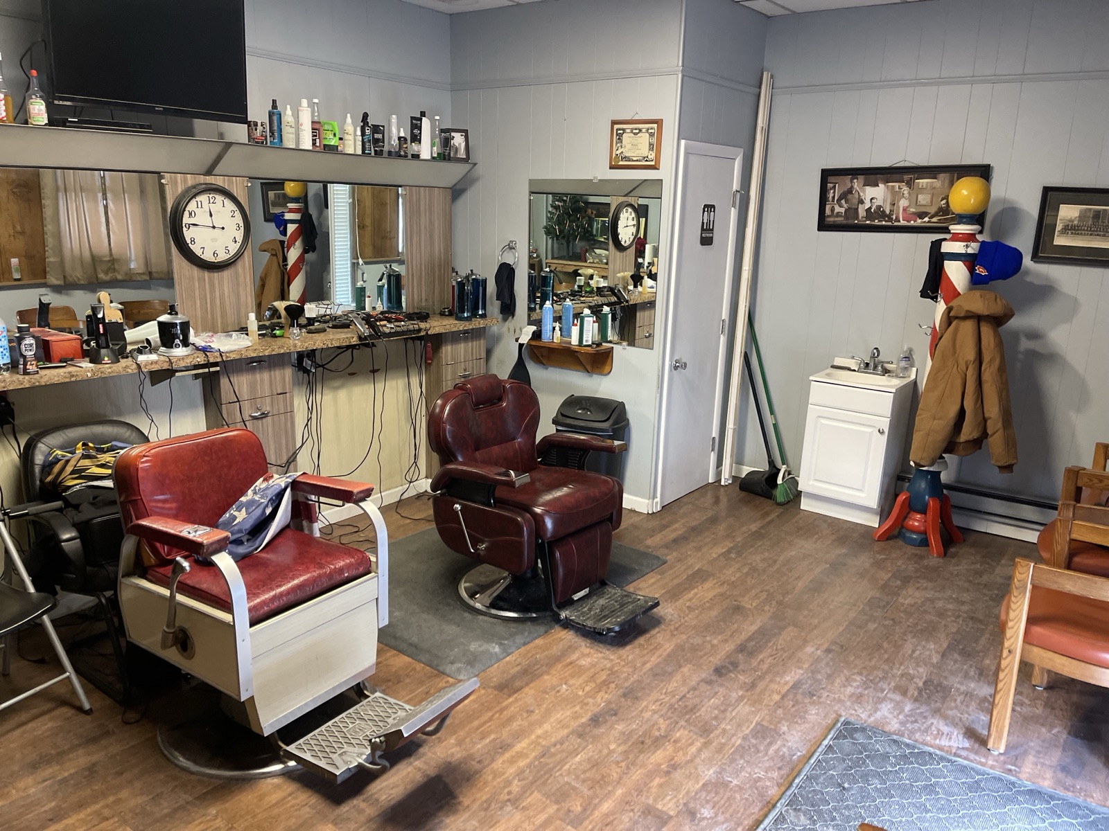 Local barbershop interior before floor renovation