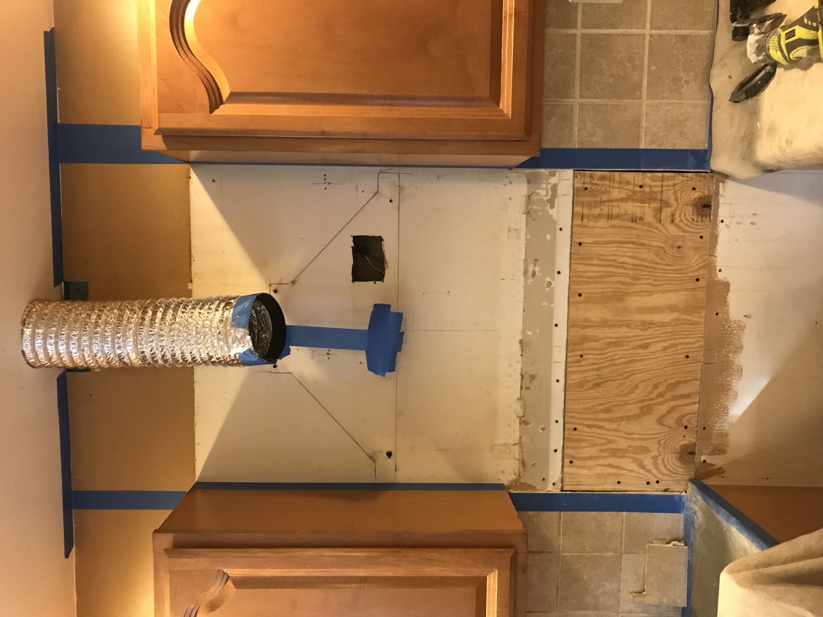 Range hood duct rough-in with framed opening and plywood backing