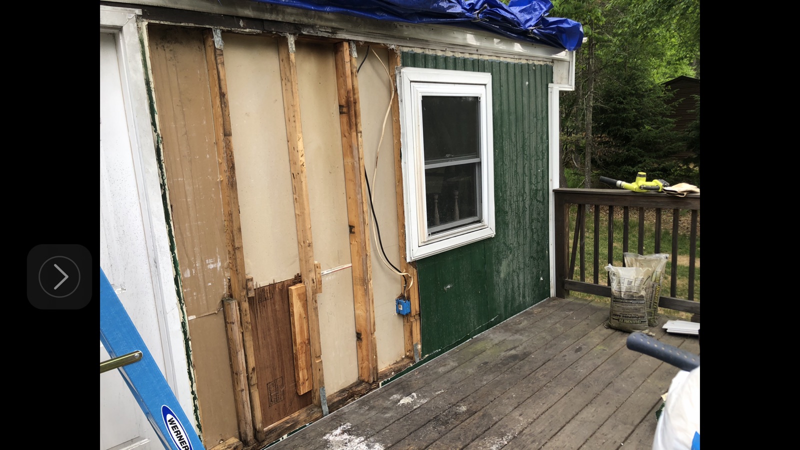 Exterior wall with old siding removed and framing exposed